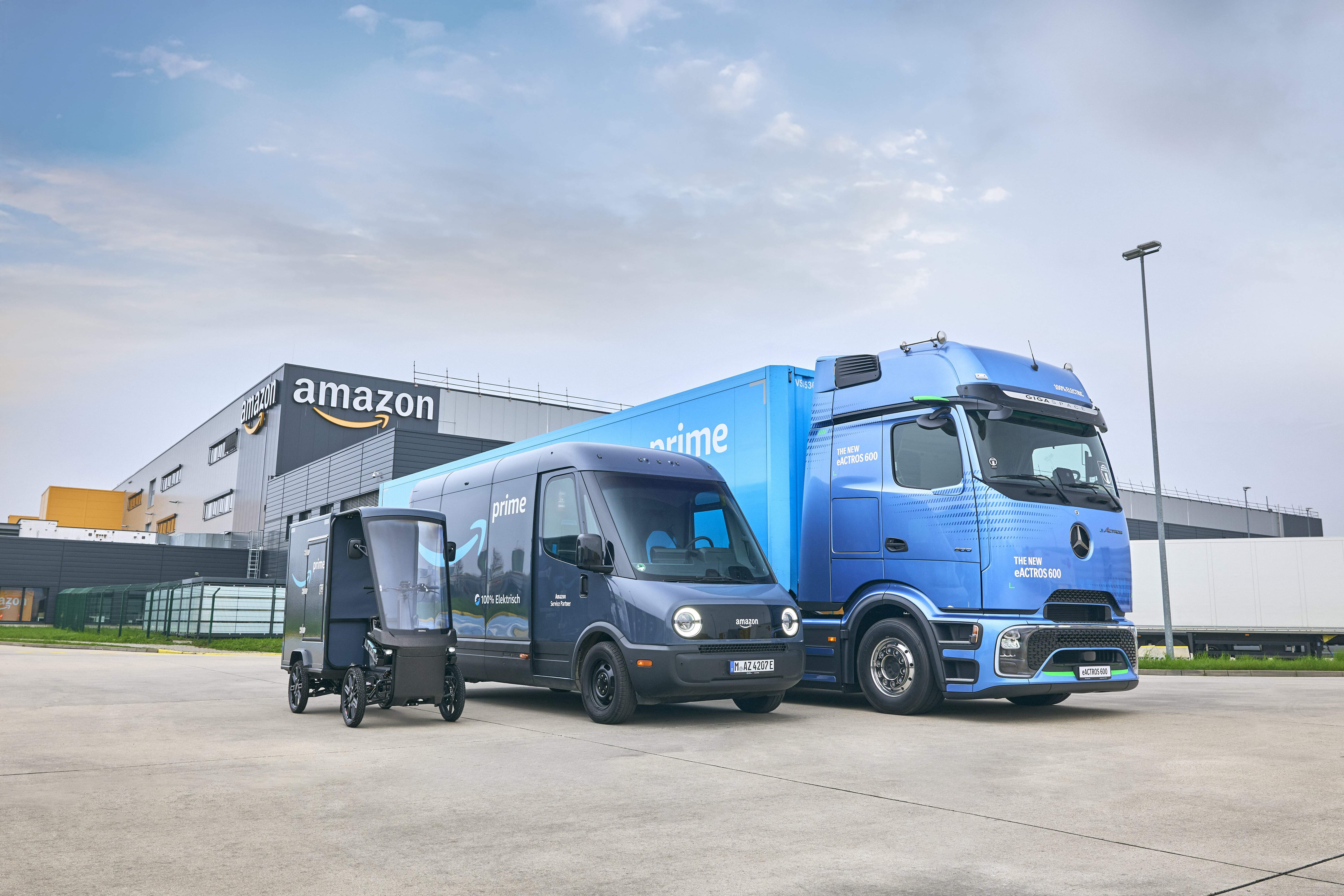 Amazon UK delivery vehicles outside a fulfilment centre